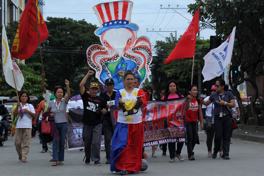 Hundreds of Davao activists march around the city to protest against APEC summit because they said it will cause more misery in the country. (Ace R. Morandante/davaotoday.com)