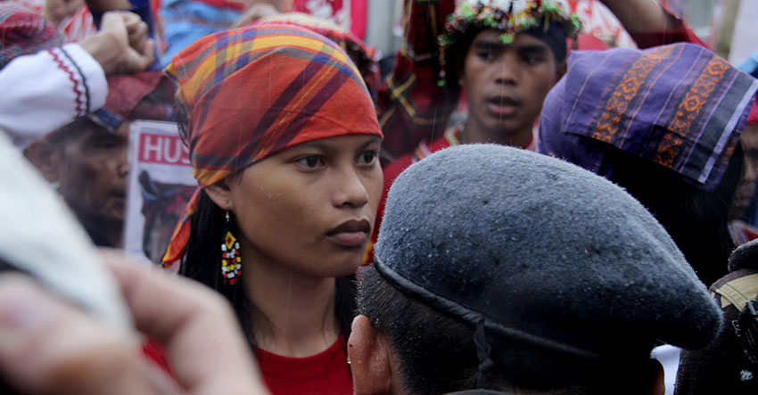 FRONTLINE. Michelle Campos, daughter of slain Lumad leader in Lianga, Surigao del Sur, together with other women Lumad leaders took the front line of the protest in Camp Aguinaldo as they face the military barricade.(Earl O. Condeza/davaotoday.com)