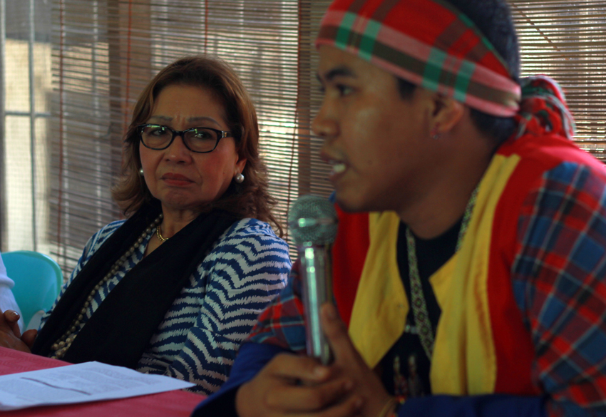 Rosario Sietas Reyes, president of the Integrated Bar of the Philippines, listens to Jong Monzon, spokesperson of the tribal group, Pasaka, as he narrates the encampment of government soldiers in their community.(Ace R. Morandante/davaotoday.com)