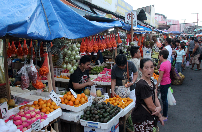 People start to buy fruits for the upcoming New Year at the Bankerohan market, while market stalls are still not crowded. Filipinos still observe a lot of traditions that in ushering a prosperous New Year, from the shape and number of fruits to be displayed on the table and the kind of meat to avoid, to making noises at the strike of 12 midnight to scare away bad spirits. Many of these customs show strong Chinese influence.(Ace R. Morandante/davaotoday.com) 