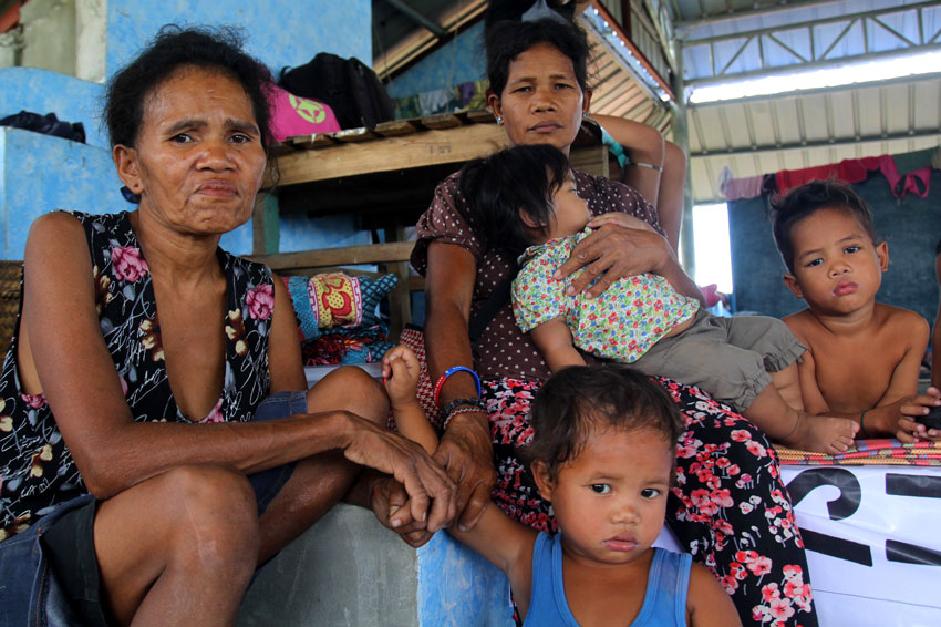 This Matigsalog tribal family from Barangay Mangayon, Compostela Valley Province is among the 133 Lumads who left their community to seek temporary refuge in Davao City due to fear of getting caught in an armed encounter between soldiers and guerrillas, as an Army unit is encamped in their area. (Ace R. Morandante/davaotoday.com)