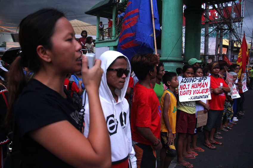 Davao activists hold protest along with the indigenous peoples "bakwit" (evacuees) in Bankerohan Public Market. The activists call for the accountability of President Benigno Aquino III over the human rights violations in Lumad communities in Mindanao. (Ace R.Morandante/davaotoday.com)