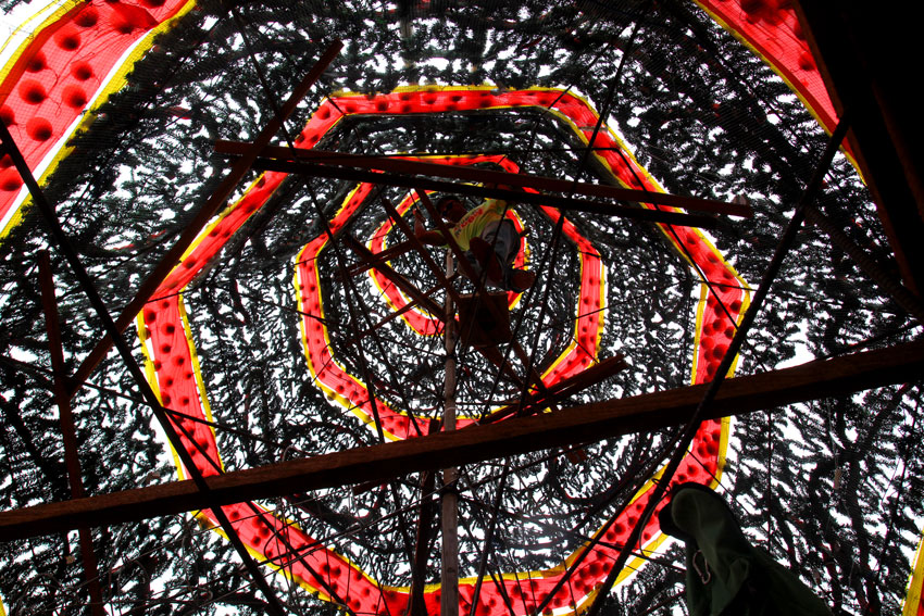 An electrician installs Christmas lights inside the 30-foot height Christmas tree in Rizal Park, Davao City. The huge Christmas tree will be lit up this coming December 4 during the opening of the Pasko Fiesta. (Ace R. Morandante/davaotoday.com)