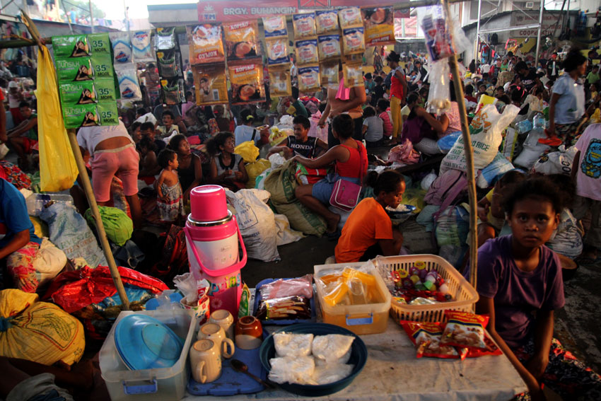 An indigenous  woman from Barangay Mapula, Paquibato district manages her store to generate income while they are in the city. (Ace R. Morandante/davaotoday.com)