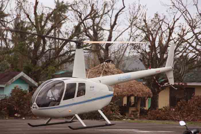 Chopper carrying advance party of Davao City mayor Rodrigo Duterte lands at Gallanosa National High School, Irosin, Sorsogon. Duterte is set to give out financial assistance to typhoon affected LGUs amounting to P500 thousand each, or a total of P7.5 million. PHOTO BY ANGEL AYALA / BICOLTODAY.COM Exclusive