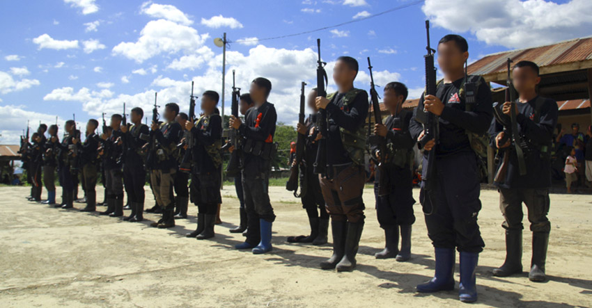Members of the Mt. Apo Subregional Command take a formation before their main activity starts to commemorate their 47th year anniversary somewhere in Bukidnon. (Ace R. Mornadante/davaotoday.com)