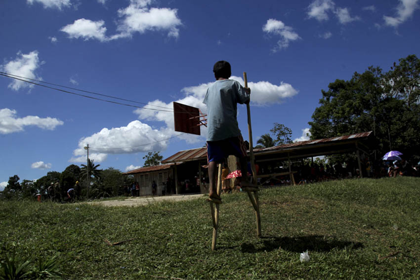 A Matigsalog child from Bukidnon plays his kadang-kadang, which are stilts made out of tree branches. (Ace R. Morandante/davaotoday.com)