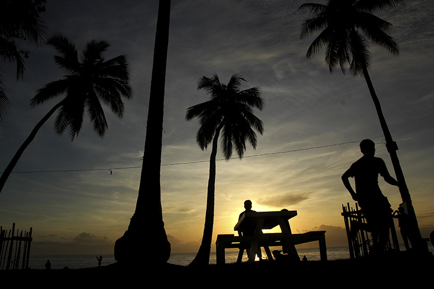 Beach lovers witness the sun rise at 5:30 in the morning in a resort in Dahican, Mati City, Davao Oriental on Sunday.(Ace R. Morandante/davaotoday.com)