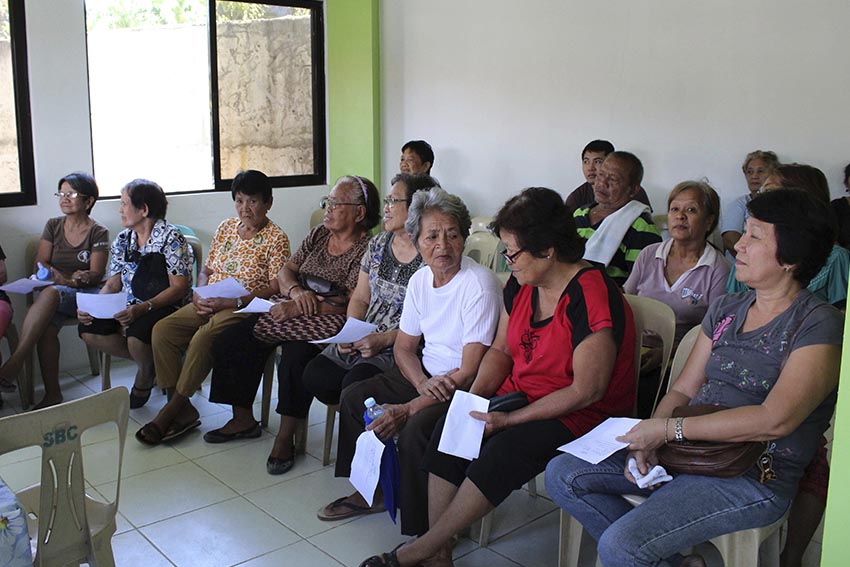 Senior citizens queue to avail free flu vaccines inside the new health center building beside Sasa Barangay Hall in Davao City. Free medicine beneficiaries arrive as early as 8:00 am on Friday. Vaccination begins at almost 11:00 am.(Medel V. Hernani/davaotoday.com)