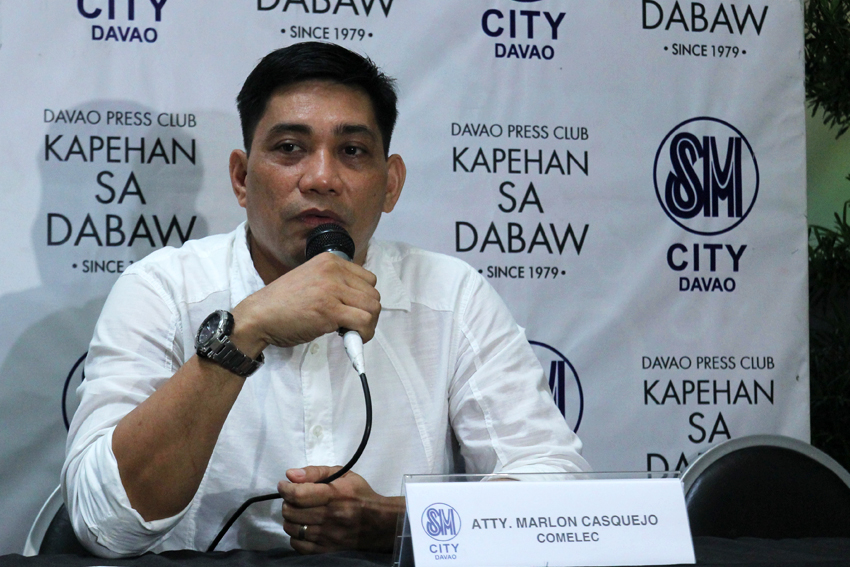 POSTER 'STRIPPERS'. Atty. Marlon Casquejo, assistant director of Comelec Region XI, says that their office and the Department of Public Works and Highways are now starting to tear down all election and non-election materials posted on prohibited areas. (Ace R. Morandante/davaotoday.com)