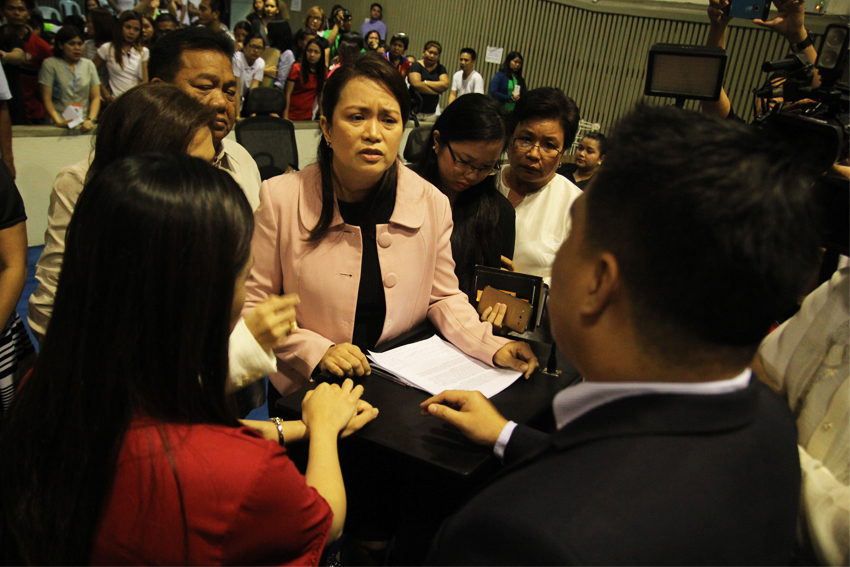 HOUSE TENSION. Davao City Councilor Mabel Sunga-Acosta turns emotional after being questioned by majority floor leader Councilor Bernard Al-ag for inviting Ateneo president Fr. Tabora to speak in the session regarding the 10% green space requirement for development projects in the city. (Ace R. Morandante/davaotoday.com)