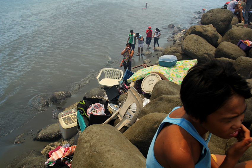 Residents close to the shore have carried their appliances and belongings outside to save it from the fire.