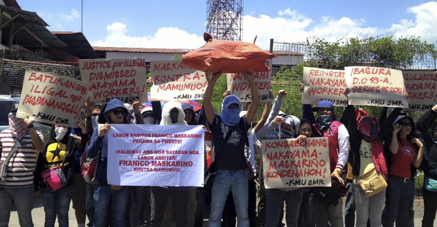 ANGER. Sacked workers of a Japanese-owned company in Digos City stage a protest before the National Labor Relation Commission Regional Arbitration Branch XI in Davao City on Monday, March 7. The government body recently junked their complaint against their former employer. (Contributed photo) 