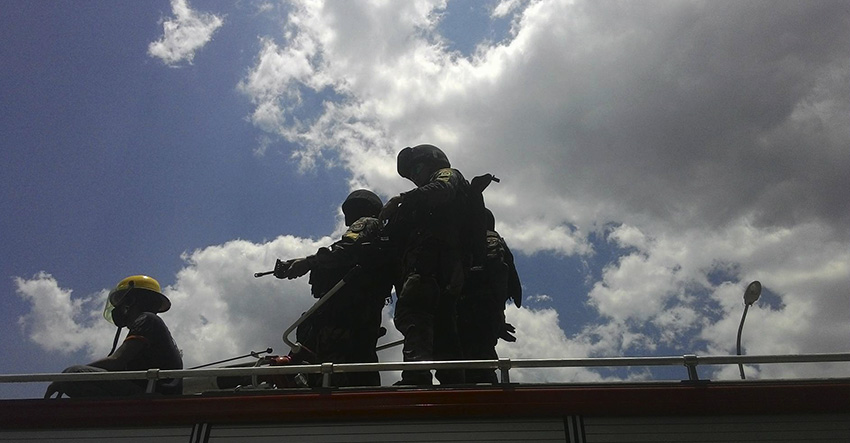 Members of the SWAT team are positioned atop fire trucks. (Contributed photo by Kathyrine Cortez)