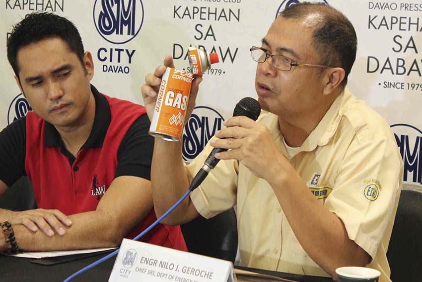 Department of Energy Chief, Engr. Nelo J. Geroche urges the media to help disseminate information regarding the danger of using butane when cooking inside the house. Geroche shows a butane canister which he said is designed only for outdoor use. (Medel V. Hernani/davaotoday.com)