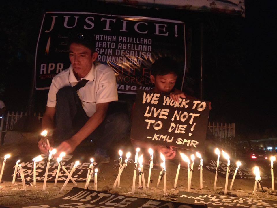 The l ​ abor ​center, Kilusang Mayo Uno, commemorates the International Workers Memorial Day calling for justice for workers who were killed and injured due to the companies lack of safety gear for workers. A candle-lighting program is held at Freedom Park in Davao City on Thursday, April 28. (Ace R. Morandante/davaotoday.com)