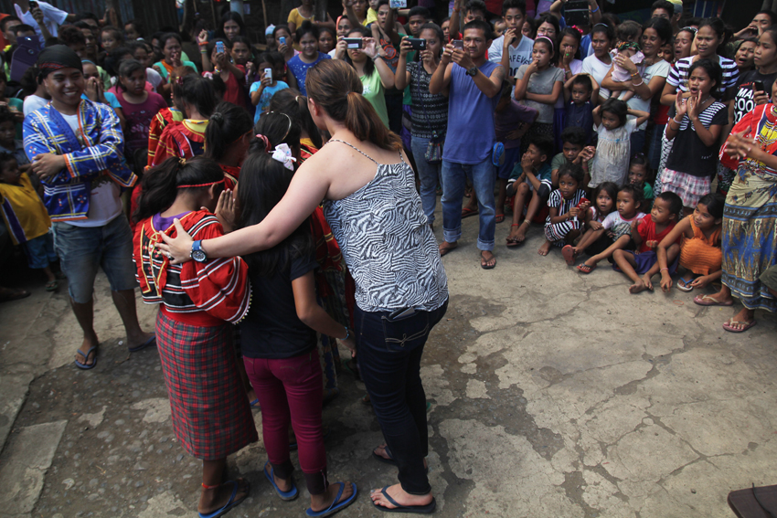 Lumad children exchange embraces with artist Aiza Seguerra and her ​ wife, Liza Diño Seguerra after they gave their message to the Lumad evacuees in UCCP Haran on Thursday, April 14. Liza said she and Aiza will return to help the Lumad evacuees who are staying for a year now inside the church compound. (Ace R. Morandante/davaotoday.com)