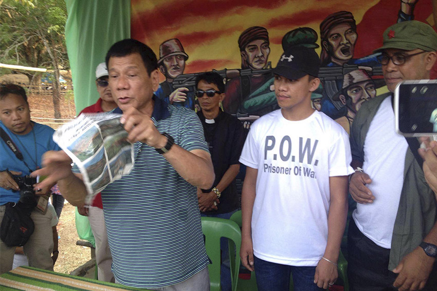 Davao City Mayor Rodrigo Duterte receives Army Private First Class Edgardo Hilaga who was freed by the New People's Army in Tulunan, North Cotabato on Tuesday, April 26. (Maria Patricia C. Borromeo/davaotoday.com)