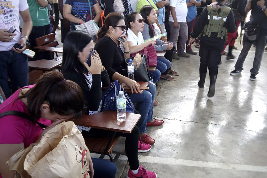 IN TEARS. Family members of the five prisoners of war policemen break into tears as they saw their loved ones at the gym in Paquibato where the release took place. (Earl O. Condeza/davaotoday.com)