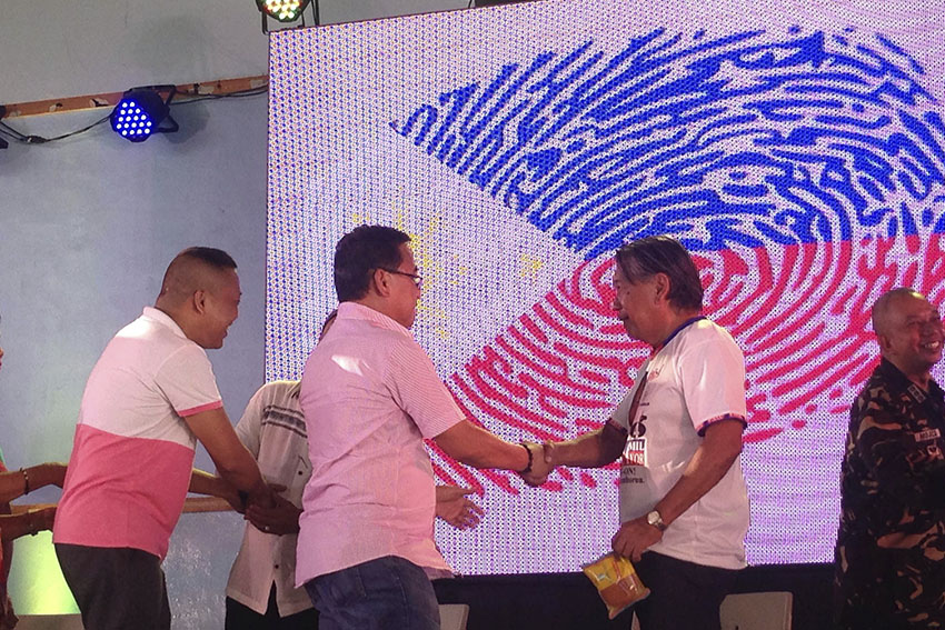 Candidates for the mayoral and vice mayoral posts in Panabo City exchange pleasantries with their opponents during the last day of the Candidates Forum 2016 held in Tagum City on Friday, April 15. (Zea C. Capistrano/davaotoday.com)