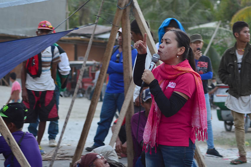 Late afternoon, support groups from Davao City arrive at the barricade and tell protesters that there are several groups outside the province who are in support of their issues. The photo shows Gabriela Women's Partylist third nominee, Bai Ali Indayla giving her speech before the farmers.