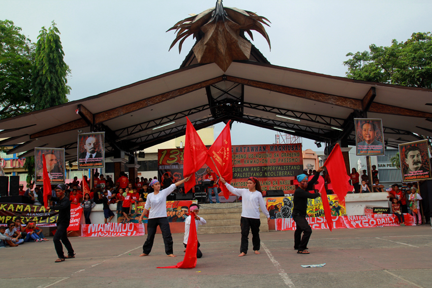 A cultural group performs a dance depicting the situation of workers in the Philippines.