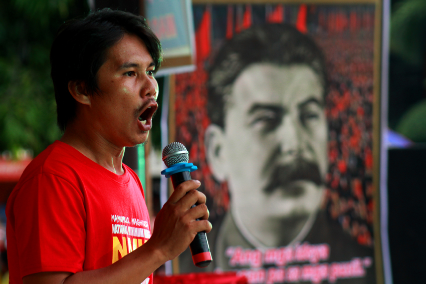 Carlo Olalo, spokesperson of Kilusang Mayo Uno challenges all the presidentiables to end contractualization in the country. On the background is a photo of the Russian leader, Joseph Stalin.