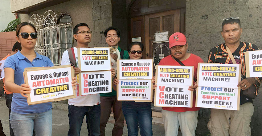 Members of Kontra Daya troop to the office of the Commission on Elections Region 11 to submit their documented report during the final testing and sealing of the vote counting machines in Davao City. (Contributed photo by Kontra Daya)