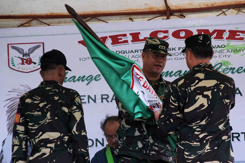 Major General Rafael C. Valencia, commander of the 10th Infantry Division hands over the Task Force Davao flag to Col. Henry A. Robinson, Jr, its new commander. Robinson replaces Col. George Joel N. Lalaquil who served the unit for only 33 days. The turn over ceremony was held at the TFD headquarters.(Ace R. Morandante/davaotoday.com)