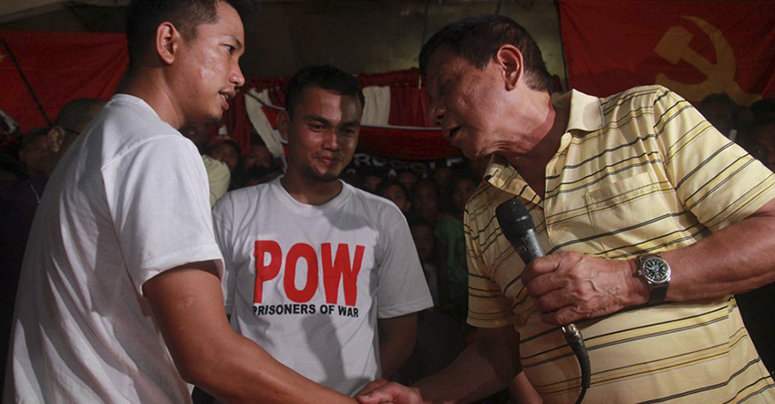 Photo caption: Presidential aspirant Rodrigo Duterte shakes hand with Private First Class Glen Austria and Pfc Diven Tawide who were released by the New People's Army on Tuesday in Agusan del Sur. (Ace R. Morandante/davaotoday.com)