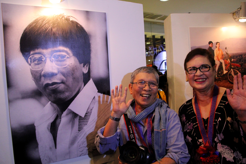 Seasoned photojournalist Rene Lumawag waves to the guests during the unveiling of his photo exhibit Rody Duterte: Through the Years at the 2nd floor of the Abreeza Mall in Davao City. Lumawag is joined by Duterte's first wife, Elizabeth Zimmerman.