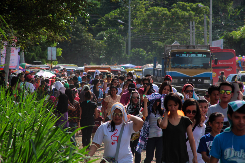 Thousands walk their way from entrance points leading to Crocodile Park in Davao City to attend the Thanksgiving Party for President-elect Rodrigo Duterte. 