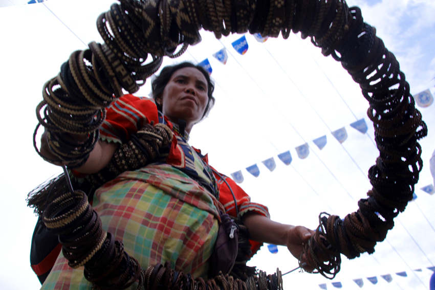 LUMAD. A Matigsalog, took the chance of attending the thanksgiving party to sell handmade indigenous accessory called "Tikus".