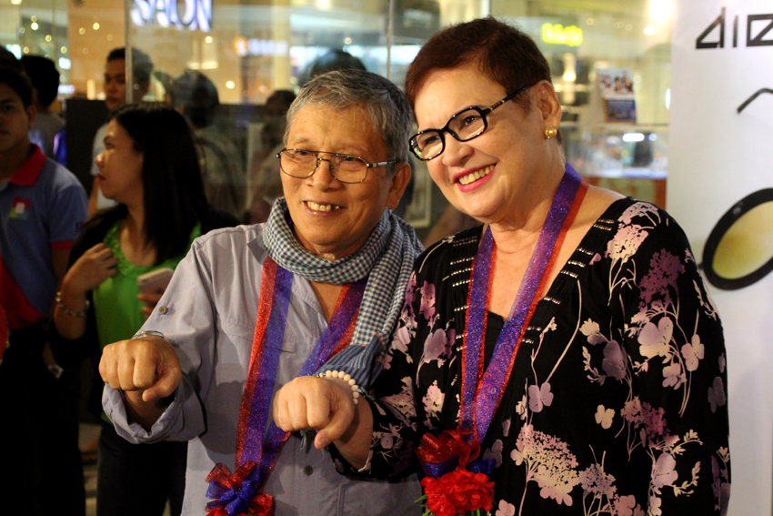 Veteran photojournalist Rene Lumawag poses with President-elect Rodrigo Duterte's first wife Elizabeth Zimmerman with the signature punching fist used during Duterte's campaign. Lumawag opens his photo exhibit which showcases the photos he took of Duterte during the mayor's 25 years of service in the city. 