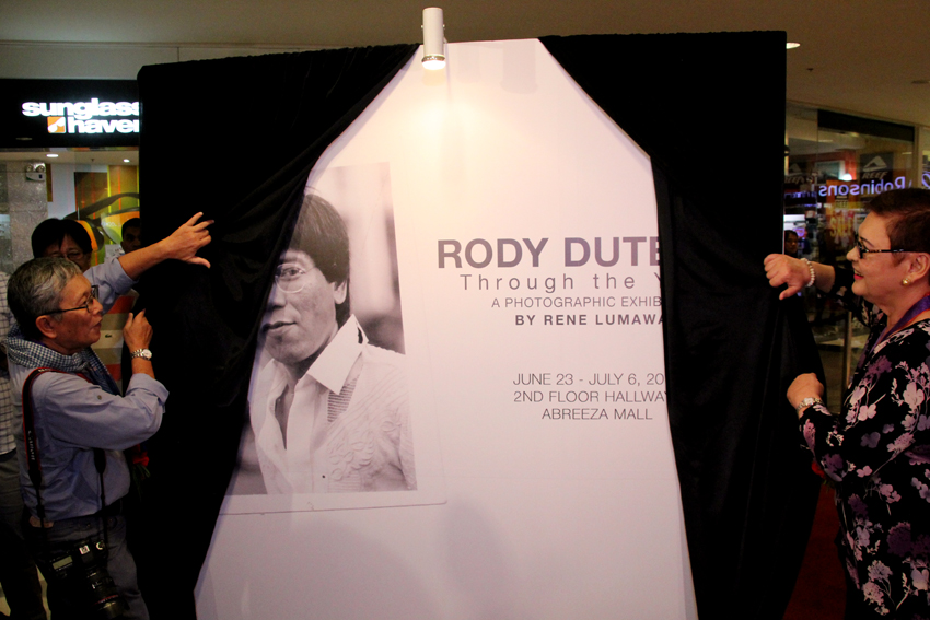 Veteran photojournalist Rene Lumawag and Elizabeth Zimmerman, the first wife of President-elect Rodrigo Duterte unveil the photo exhibit Rody Duterte: Through the years on Thursday afternoon, June 23 at the 2nd floor of the Abreeza Mall in Davao City.