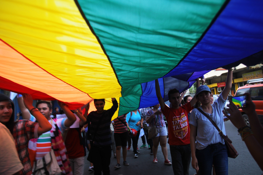 Members of the LGBT community carry a giant rainbow flag as they march against discrimination during the first Pride March in Davao City on Wednesday, June 1. (Ace R. Morandante/davaotoday.com)