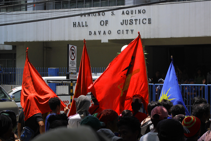 Almost 1,000 protesters march to the Hall of Justice in Davao City to condemn the alleged trumped-up cases filed against 15 leaders of progressive organizations. The warrant of arrest for cases of kidnapping and serious illegal detention of the indigenous people's evacuees in Davao City is issued on May 13 by Judge Retrina Fuentes of Regional Trial Court 10 . (Ace R.Morandante/davaotoday.com)