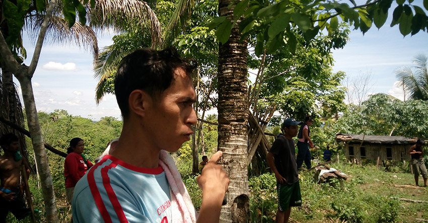 MISSING POULTRY. Aladin Rosquites points to the cage where their chickens are kept. The chicken have been lost after alleged soldiers fired at their house. (Earl O. Condeza/davaotoday.com)