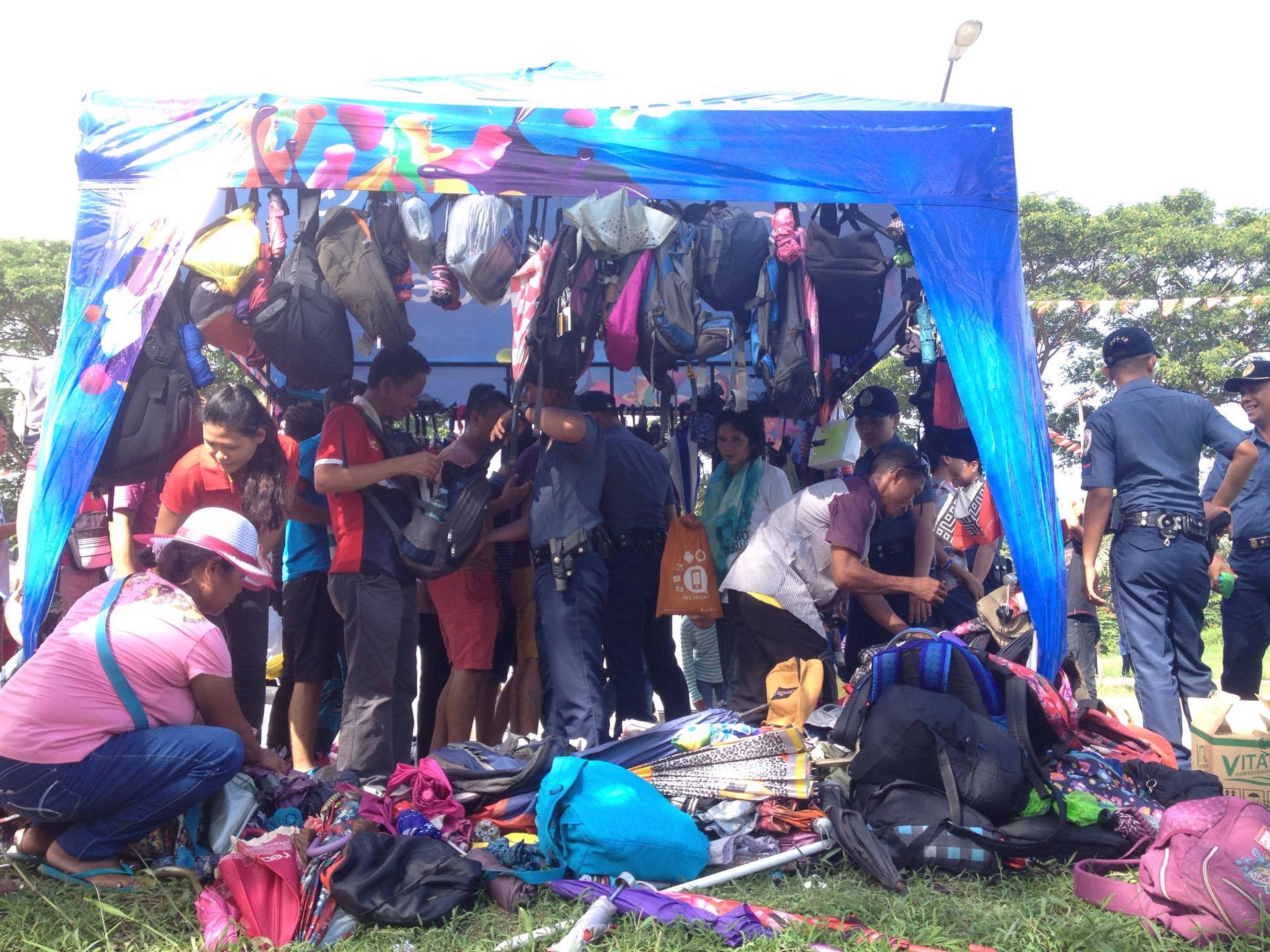 CONFISCATED. The police confiscate bags and umbrellas from party-goers. The organizers have announced earlier that those items will be prohibited inside. However, no claim stubs were given to those who left their belongings . (Ace R. Morandante/davaotoday.com)