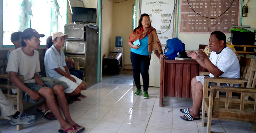 AID. Kapatagan Barangay Captain Moises D. Doca assures the family of the Rosquites to shoulder the damages to their house when armed men believed to be soldiers fired at their house. (Earl O. Condeza/davaotoday.com)