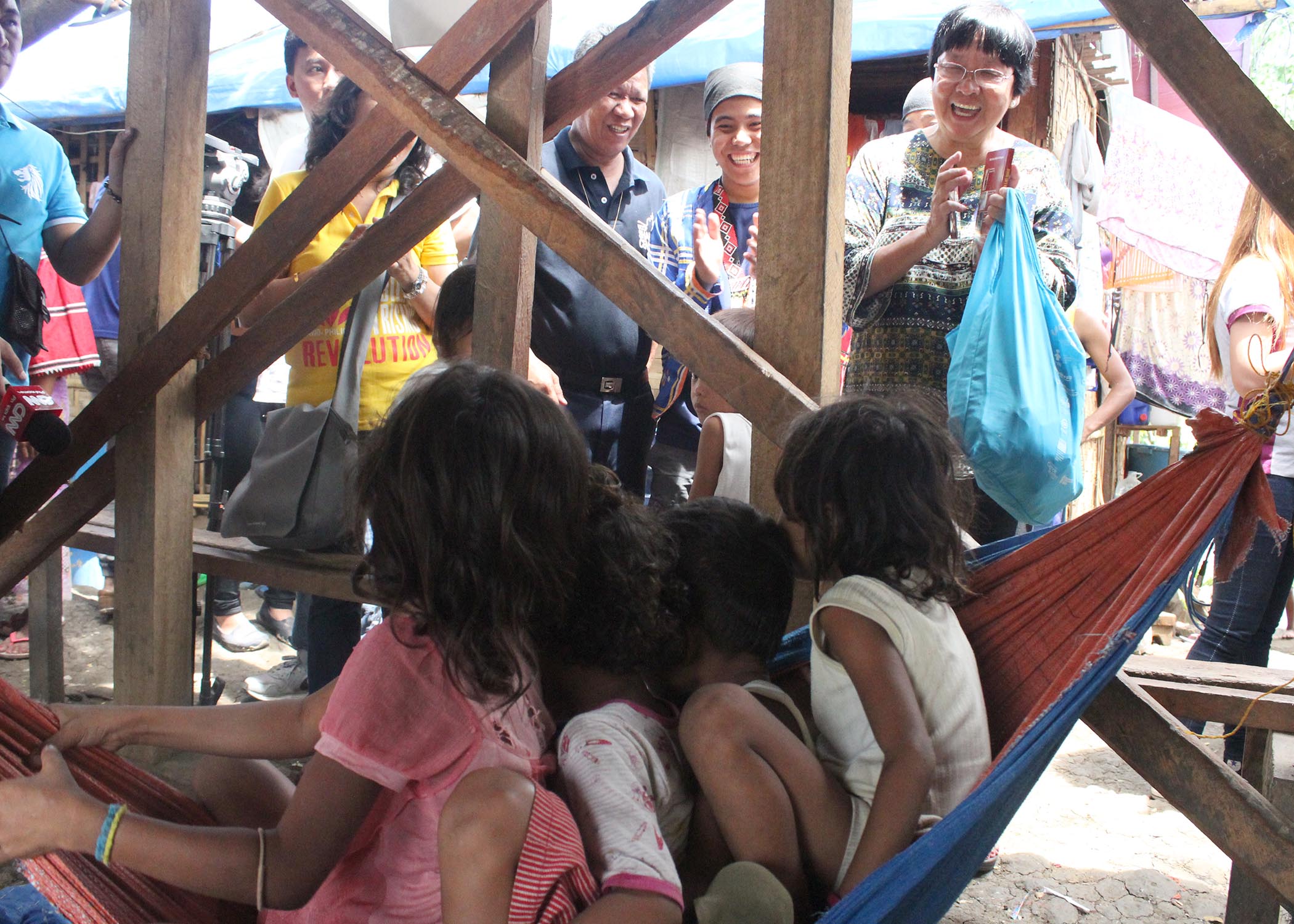 Incoming Social Welfare and Development Secretary Judy Taguiwalo exchanges laughters with the Lumad children inside the evacuation center at the United Church of Christ in the Philippines Haran compound during her visit on Wednesday, June 1. (Medel V. Hernani/davaotoday.com)