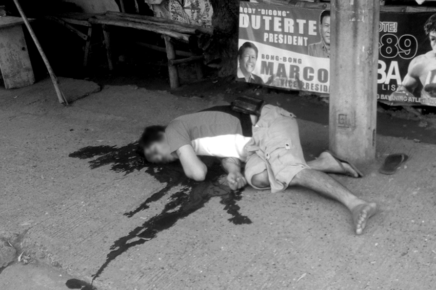 Nestor Siazon, 30, sprawls bloodied in the pavement beside his mini shop at the corner of Damosa, Lanang, Davao City. Witnesses tell police probers he was killed by two men in motorcycle at around 10:00 am on Friday. (Photo by MPG-DCPO)