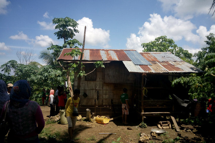 The house where two members of the family decide to take their  rest before working as rubber tappers, least expecting a strafing incident to happen soon. (Earl O. Condeza/davaotoday.com)