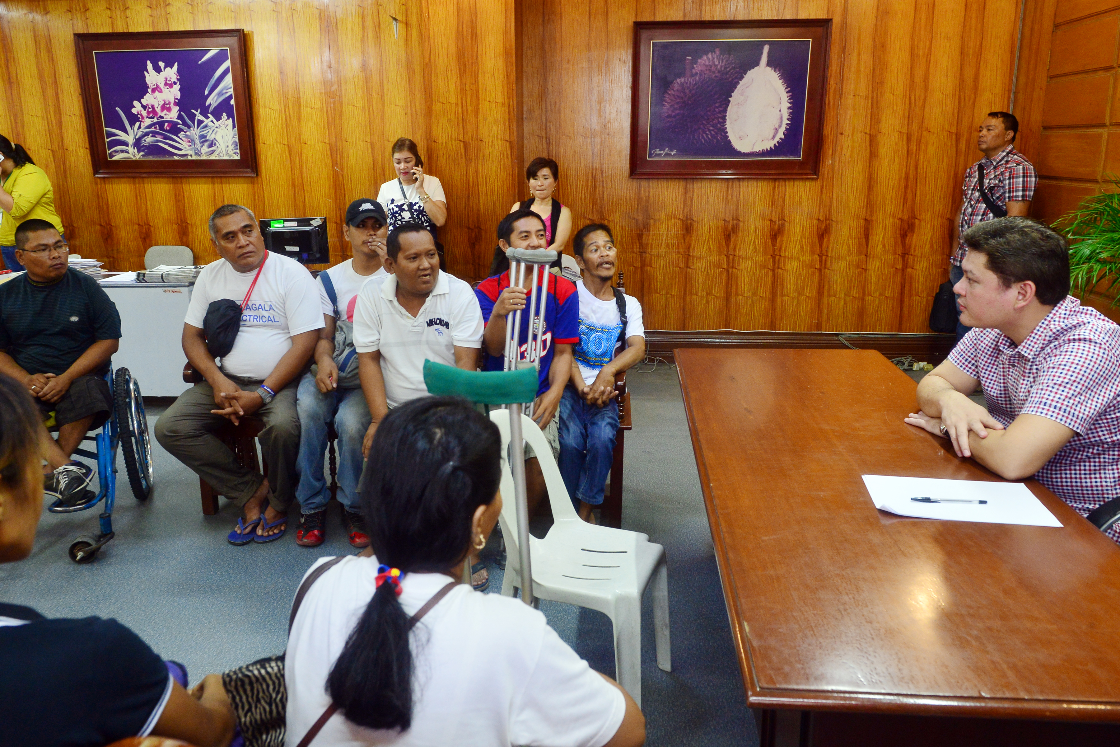 A number of indigents and persons with disabilities talk with Davao City Vice Mayor Paolo Duterte at his office Monday, July 4. Duterte is now the acting mayor as his sister, Mayor Sara Duterte-Carpio is on leave until July 22.  (Photo by Davao City Information Office)