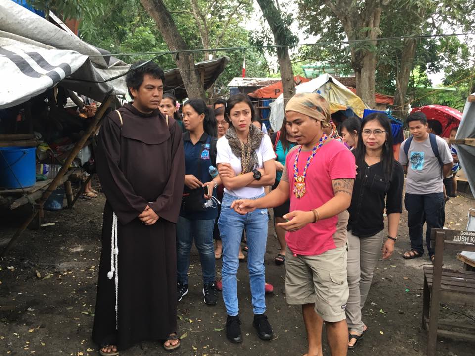 Actress Jodi Sta. Maria listens to Lumad leader, Jong Monzon of the Pasaka Confederation of Lumad Organizations during her visit at the United Church of Christ in the Philippines Haran compound on Tuesday afternoon, July 19. (Photo by Glades Jane Maglunsod)