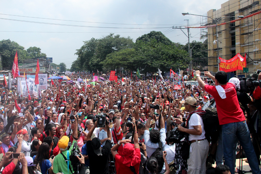 Upon reaching the venue of their People's SONA, marchers raised their fists to celebrate the "historic" occasion of holding the program only a few hundred meters away from Batasan Complex.