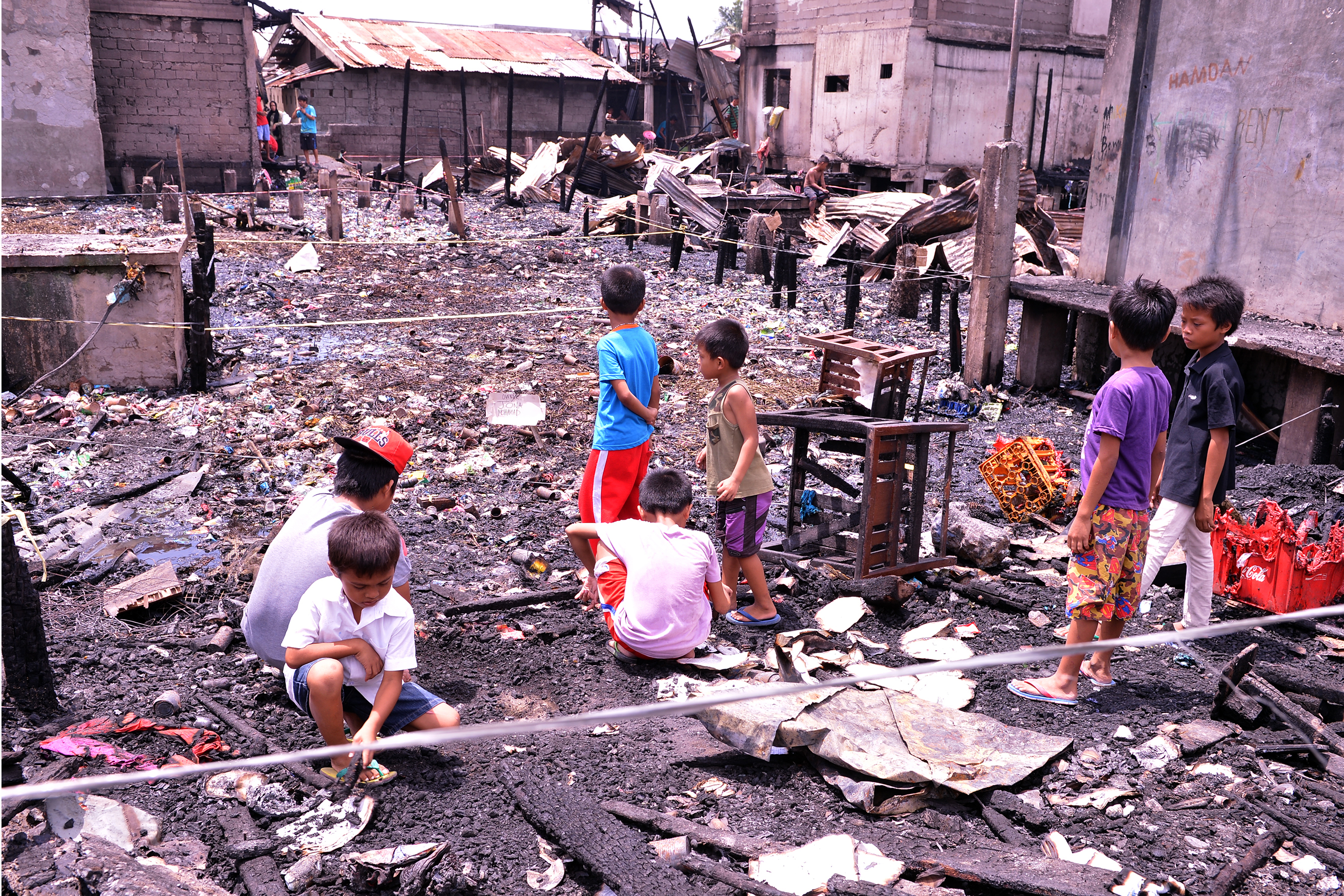 These children are among those who were left homeless after fire gutted their community in Purok 4A, Barangay 23-C Mini Forest in Davao City early morning Thursday, August 18, 2016. The Davao City Social Services and Development Office (CSSDO) said more or less 36 families were affected by the fire. (City Information Office)