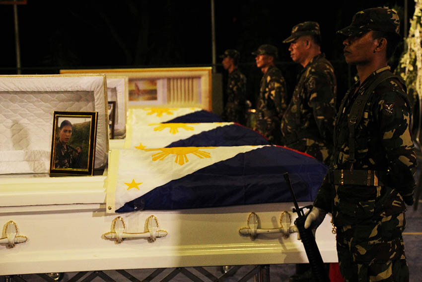 HONOR GUARDS. Soldiers stand as honor guards to the coffins of four soldiers who died in a series of offensives by the 8th Pulang Bagani Company of the New People's Army in Monkayo Town, Compostela Valley.The four soldiers are currently laid at state in Naval Station Felix Apolinario in Panacan, Davao City. (Paulo C. Rizal/davaotoday.com)