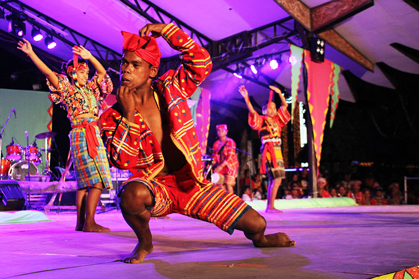 DAILY LIFE. In one of this year's Kadayawan sa Dabaw highlight, members of the Ata tribe perform a cultural dance that resembles their commitment to passing on their culture to the youth during the opening of the "Tribuhanong Pasundayag" (Tribal presentation) on Wednesday evening, August 16 at the Rizal Park in Davao City. (Paulo C. Rizal/davaotoday.com)