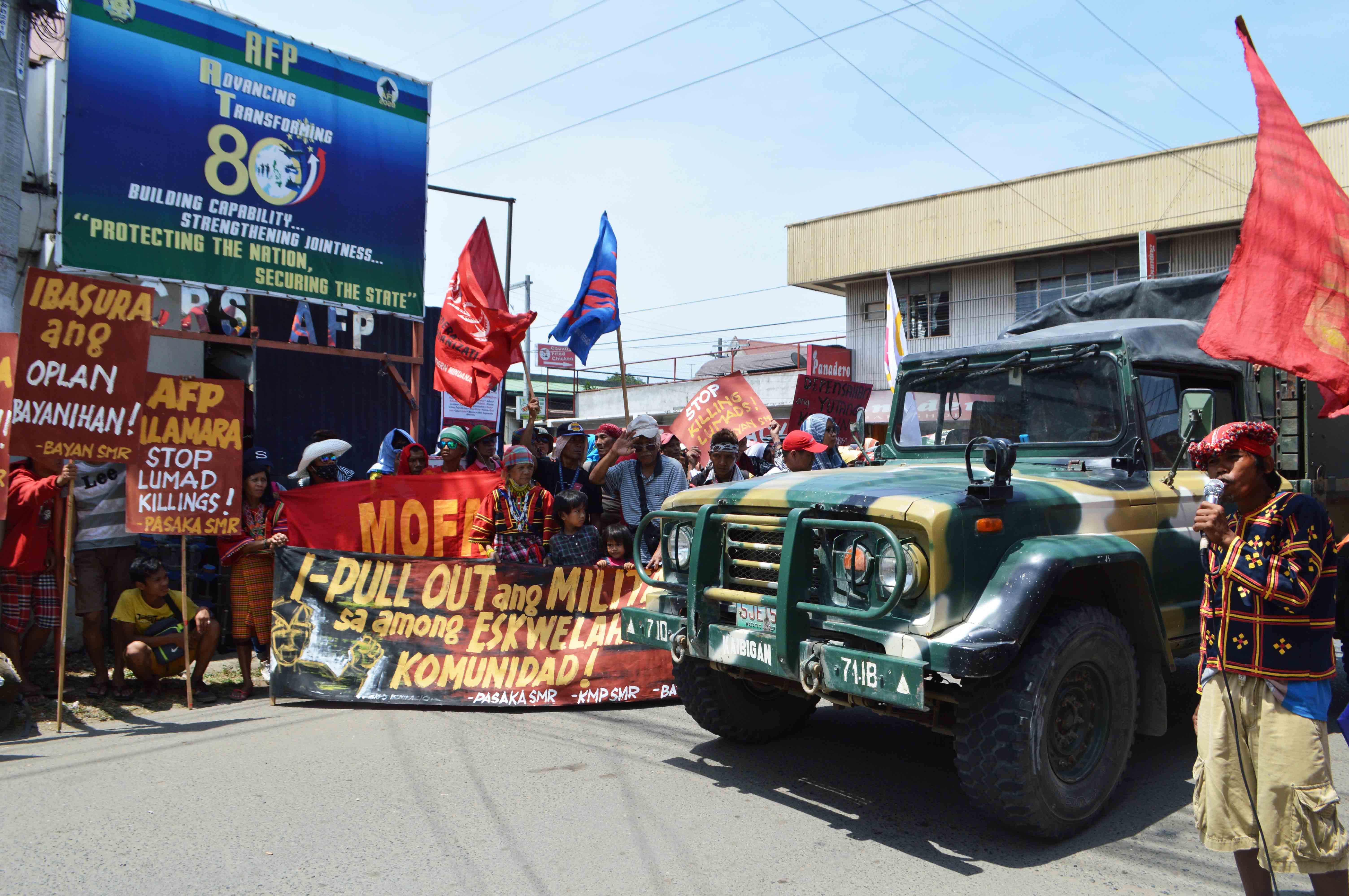 A military truck pass by the rally outside the headquarters of the Eastern Mindanao Command.